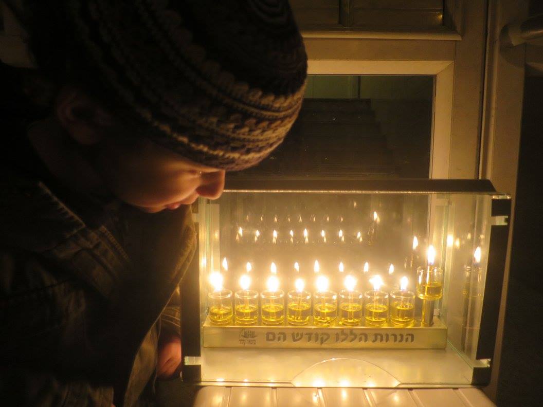 child with menorah