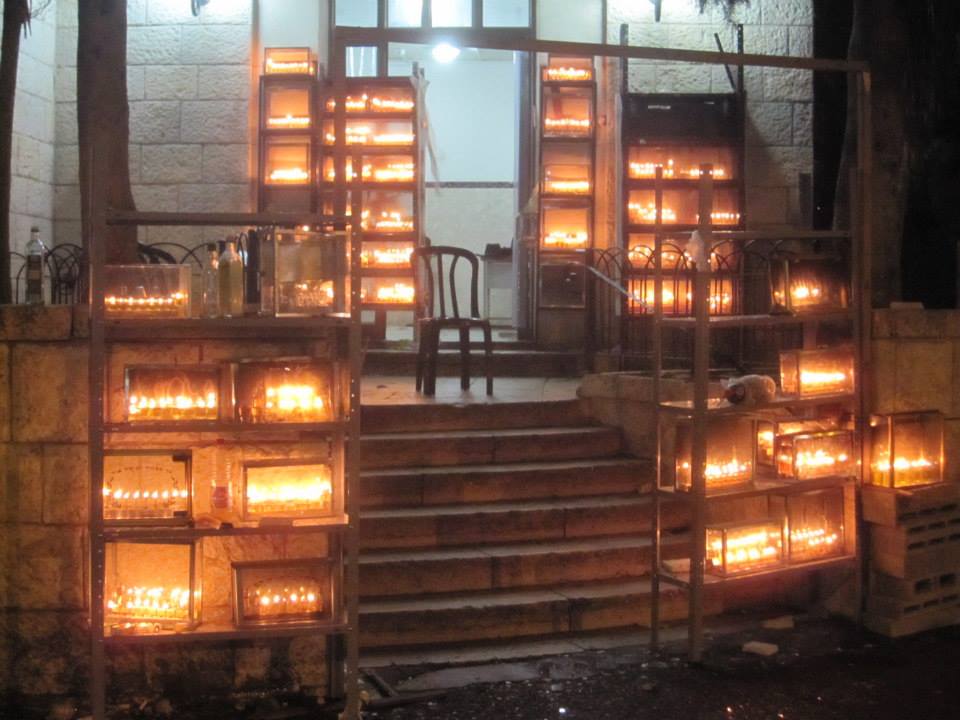menorahs in alleyway