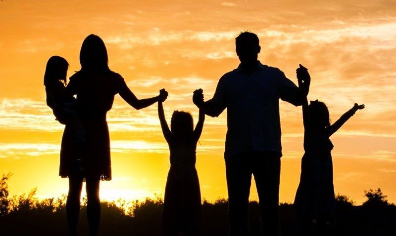 family silhouette sunset