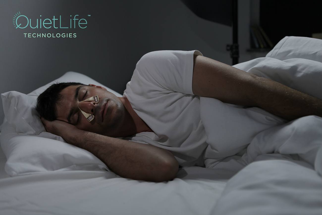 Man asleep wearing device