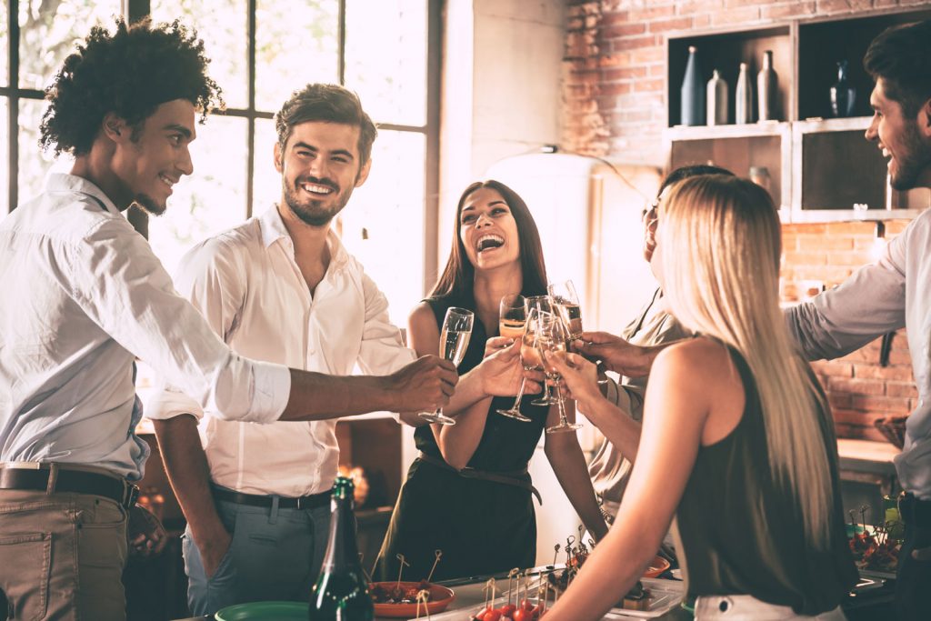 friends saying l'chaim in Hebrew or cheers in English