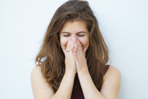 a girl feeling good when getting a firgun in Hebrew that means getting a complement