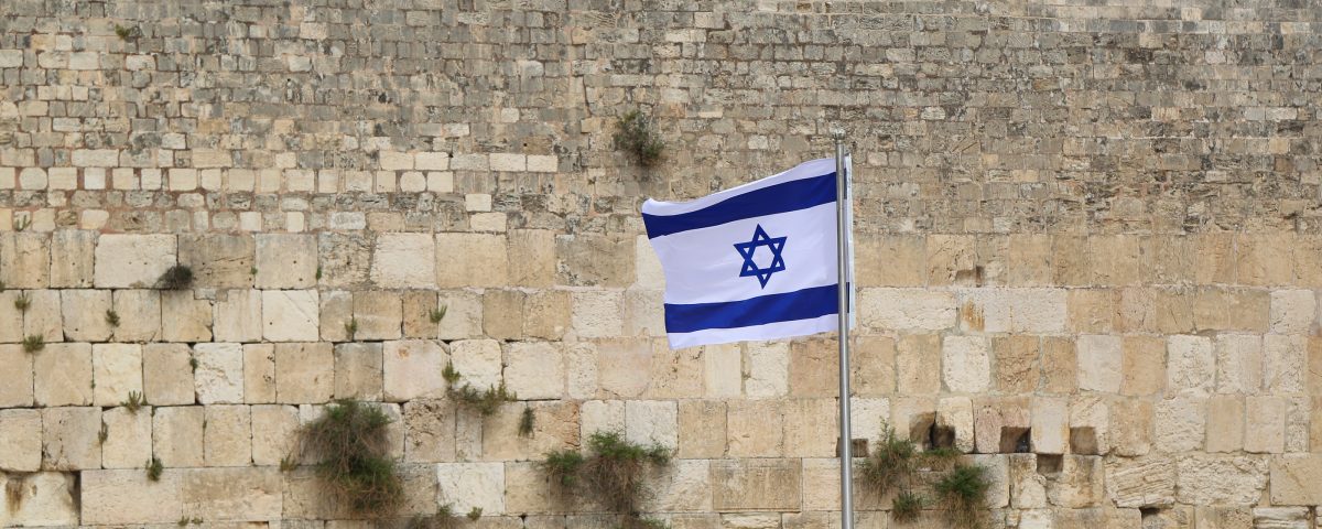 Israeli Flag in front of the Western Wall in the Old City of Jerusalem.