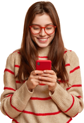 indoor-photo-satisfied-teenage-girl-texts-cellular-reads-interesting-article-online-wears-casual-outfit-creats-new-publication-own-web-page-isolated-brown-wall-with-free-space 1